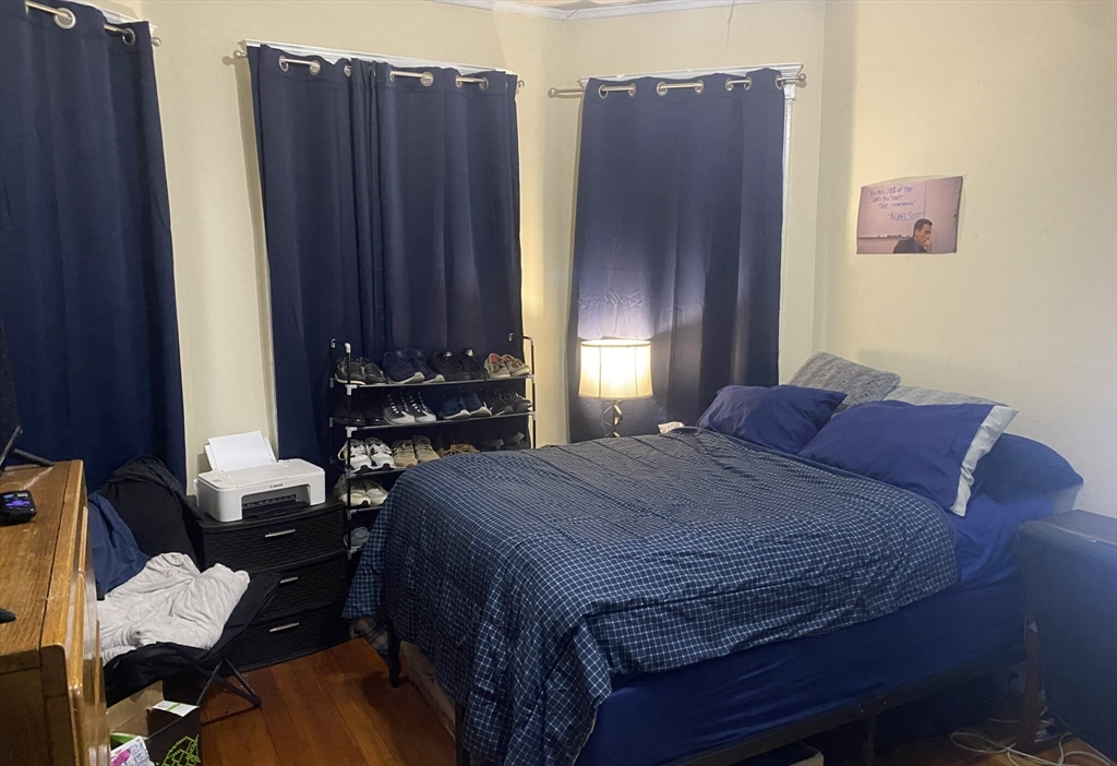 2 Imrie Road, Unit 1 Boston, MA 02134 - Photo 4 of 6 a bedroom with bed and two windows