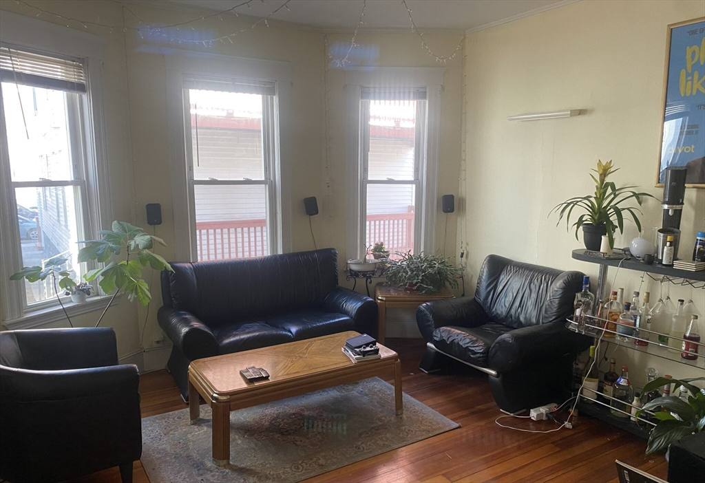 2 Imrie Road, Unit 1 Boston, MA 02134 - Photo 5 of 6 a living room with furniture rug and window