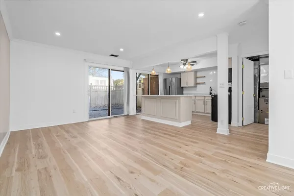 a kitchen with stainless steel appliances a sink stove and refrigerator