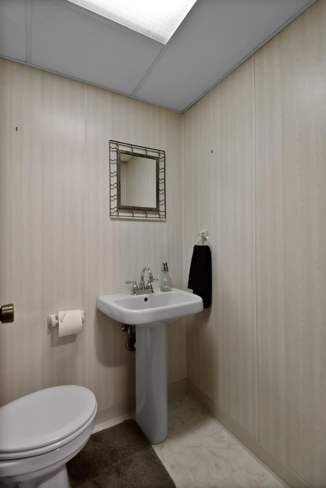279 Robbie Lane Valparaiso, IN 46385 - Photo 19 of 35 a bathroom with a toilet a sink and mirror