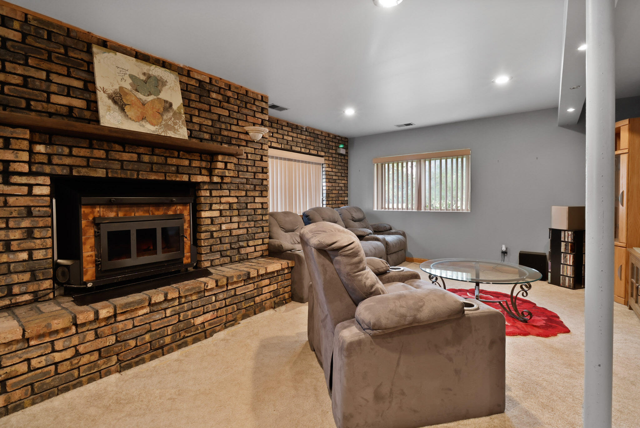 279 Robbie Lane Valparaiso, IN 46385 - Photo 21 of 35 a living room with furniture a flat screen tv and a fireplace