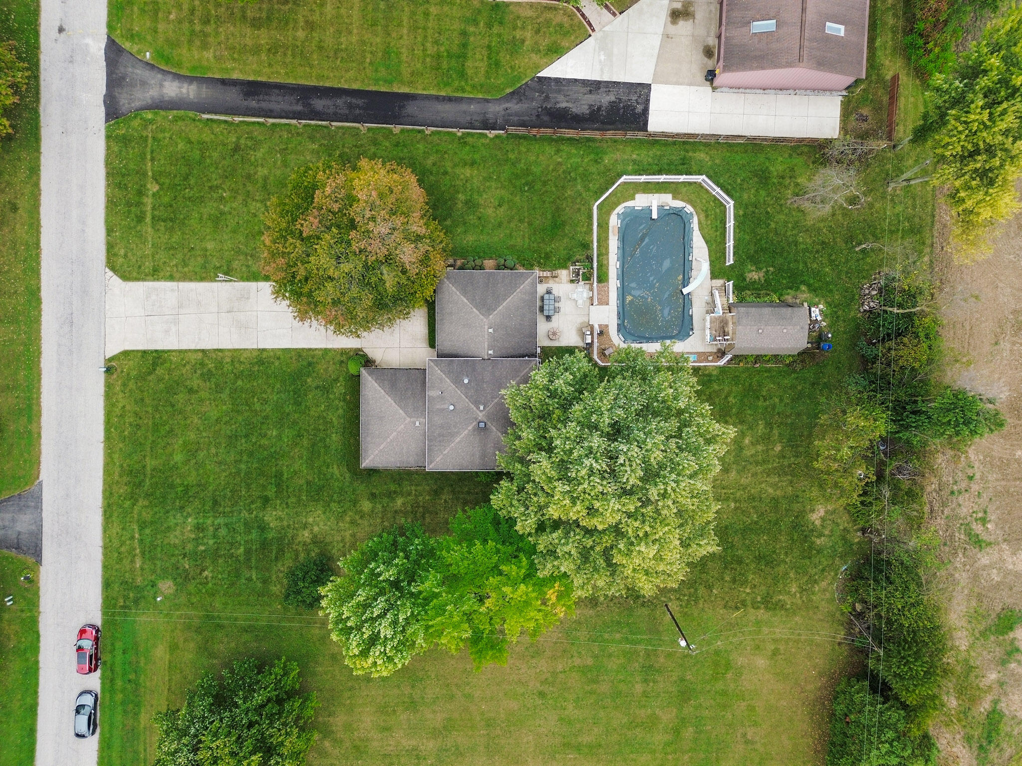 279 Robbie Lane Valparaiso, IN 46385 - Photo 32 of 35 an aerial view of a house with garden space and outdoor seating