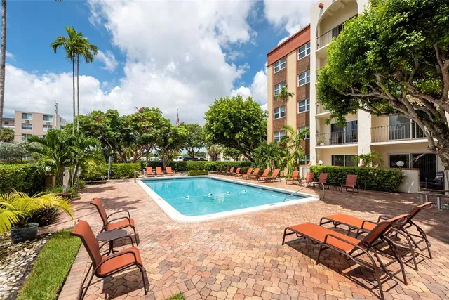 a view of a patio with swimming pool