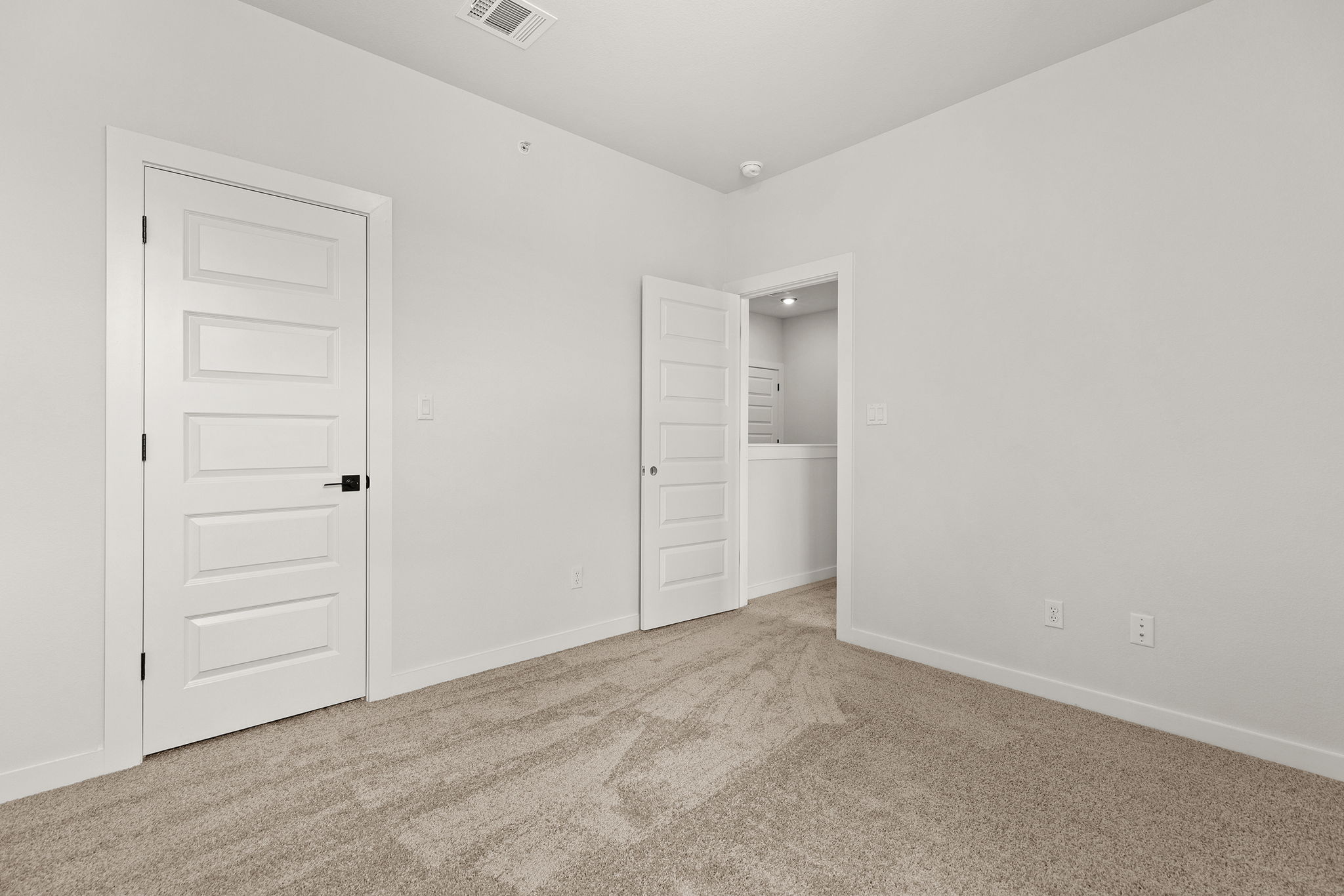 2600 Gattis School Road, Unit 1002 Round Rock, TX 78664 - Photo 25 of 40 Comfortable carpeting and fresh walls define this quiet, ready-to-personalize bedroom space.