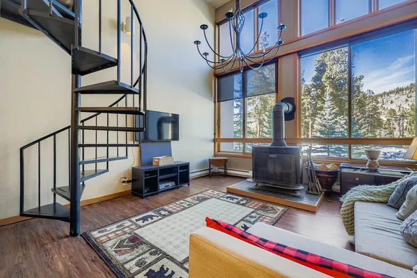 a living room with furniture fireplace and a table