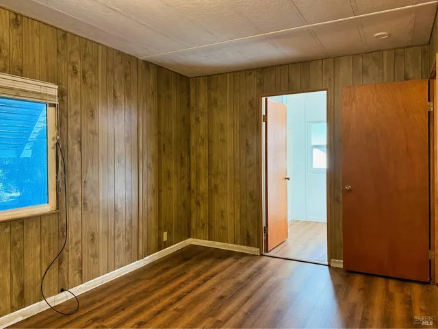 a view of hallway with wooden floor