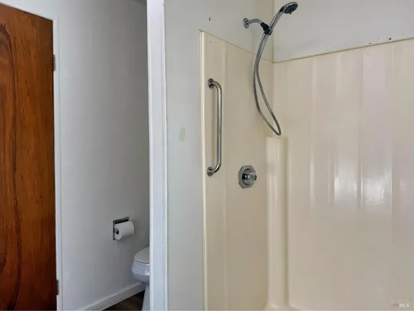 a view of a bathroom from the hallway