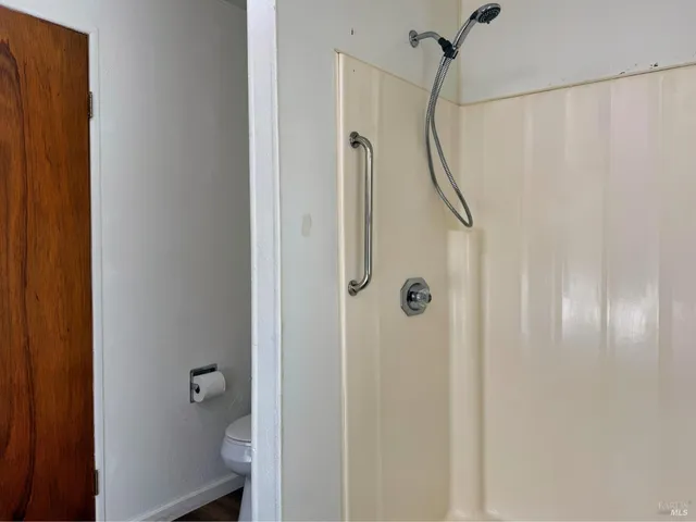 a view of a bathroom from the hallway