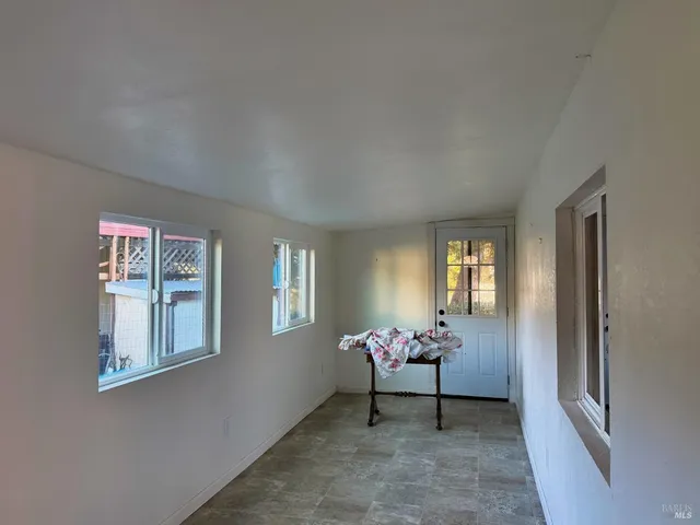 a living room with furniture and windows