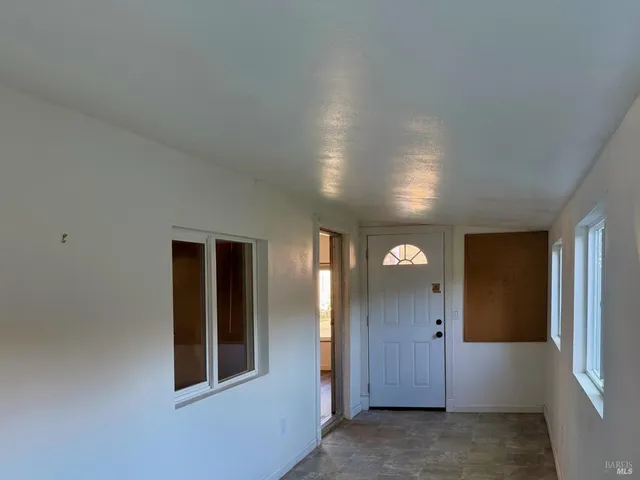 a view of a hallway with windows