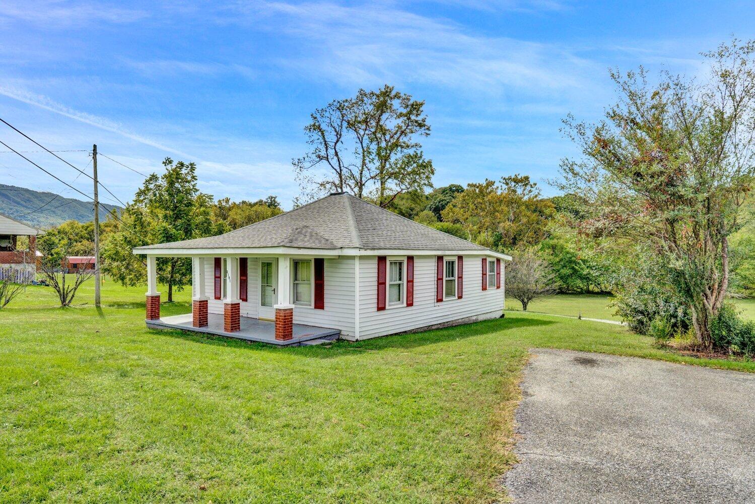 3191 Webster Road Blue Ridge, VA 24064 - Photo 2 of 18 a front view of a house with a garden