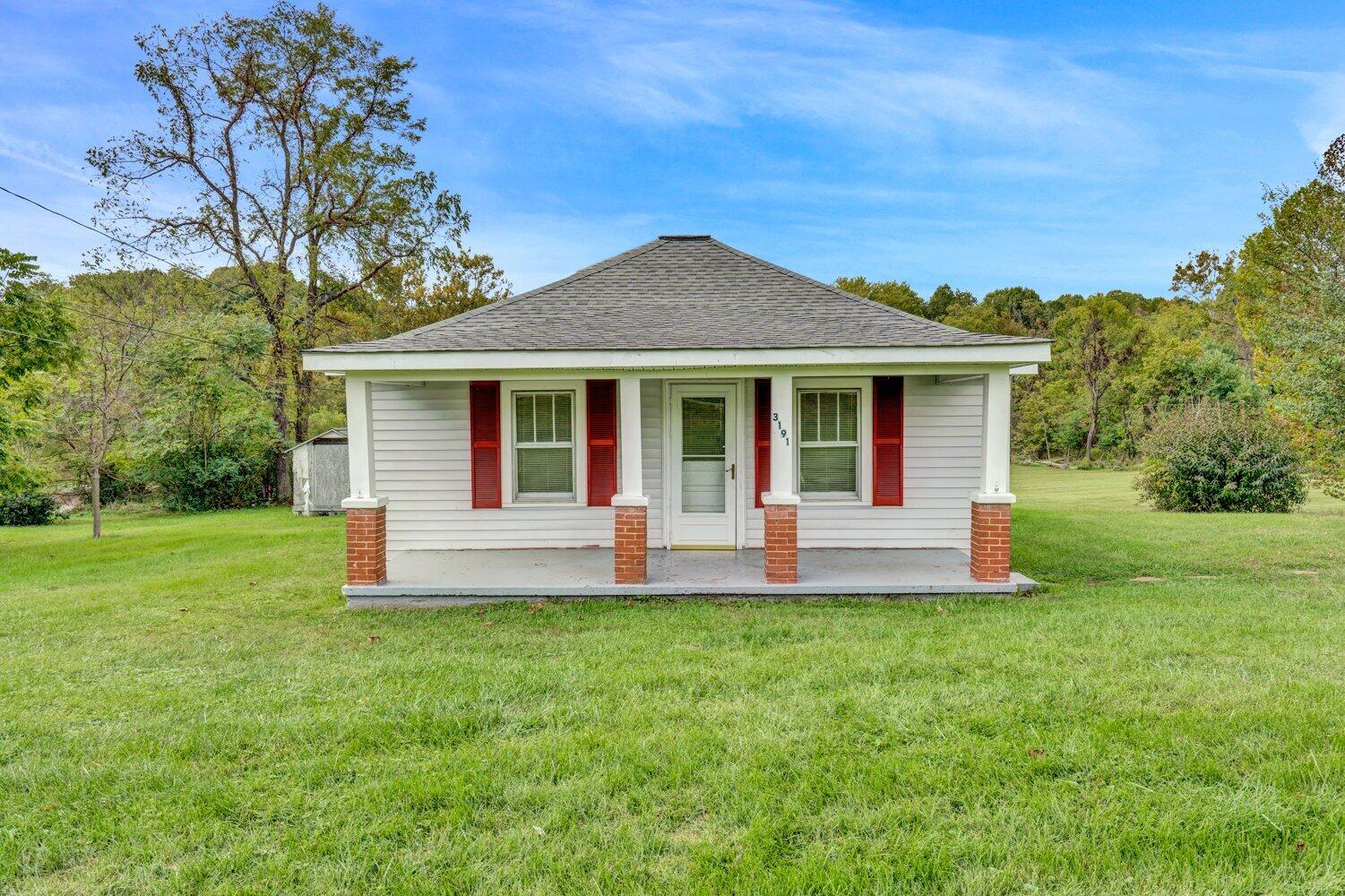 3191 Webster Road Blue Ridge, VA 24064 - Photo 3 of 18 a front view of a house with a yard and porch