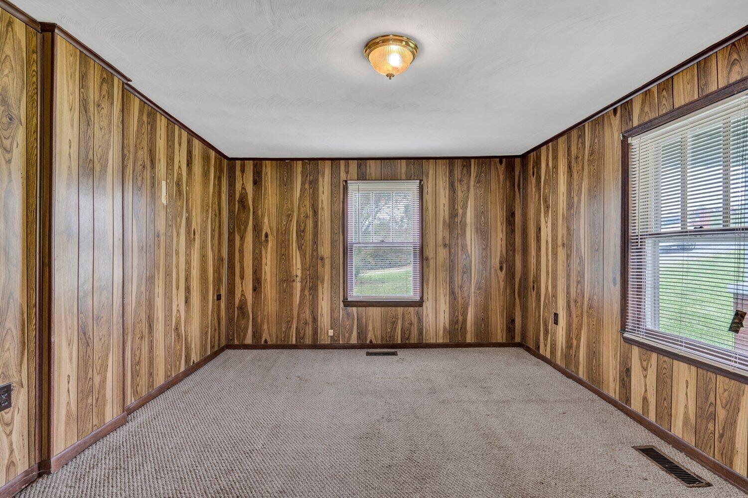 3191 Webster Road Blue Ridge, VA 24064 - Photo 5 of 18 a view of an empty room with a window
