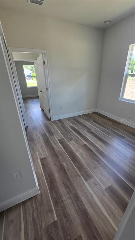 Undisclosed Address Orlando, FL 32805 - Photo 5 of 16 a view of empty room with wooden floor and fan