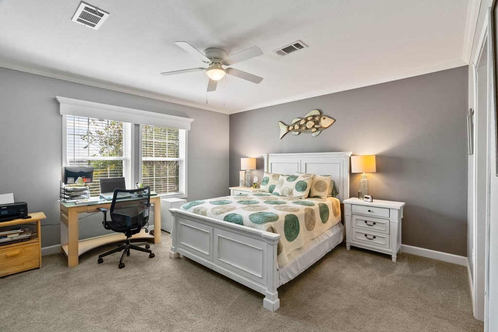 159 Copano Ridge Road Rockport, TX 78382 - Photo 18 of 31 a bed room with a bed and a chair