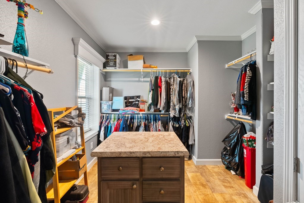 159 Copano Ridge Road Rockport, TX 78382 - Photo 19 of 31 a view of walk in closet with clothes