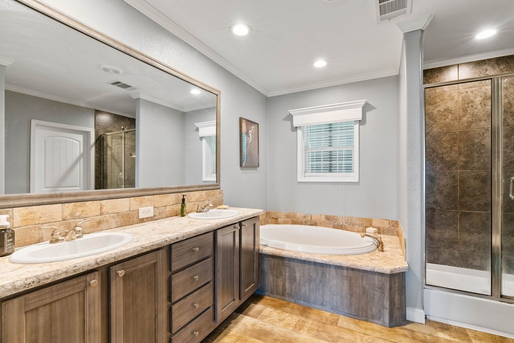 159 Copano Ridge Road Rockport, TX 78382 - Photo 20 of 31 a bathroom with a granite countertop tub sink and mirror
