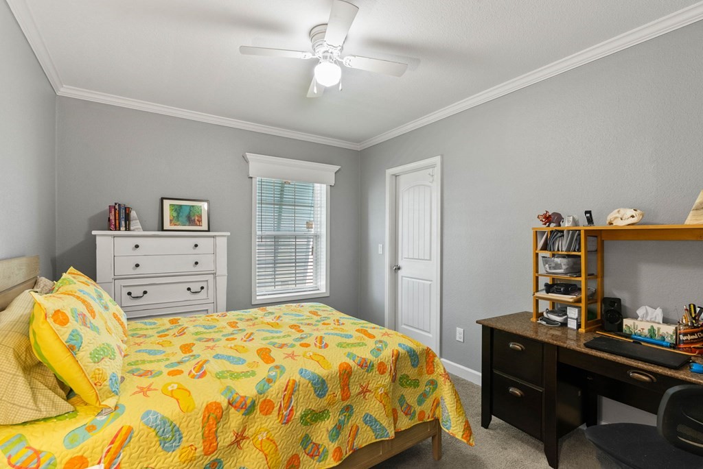 159 Copano Ridge Road Rockport, TX 78382 - Photo 24 of 31 a bedroom with a bed and wooden floor