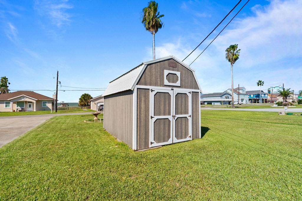 159 Copano Ridge Road Rockport, TX 78382 - Photo 27 of 31 a view of a house with a yard