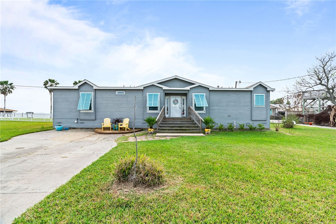 159 Copano Ridge Road Rockport, TX 78382 - Photo 31 of 31 a front view of a house with garden
