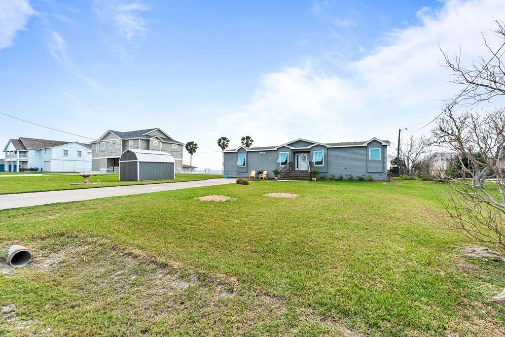 159 Copano Ridge Road Rockport, TX 78382 - Photo 6 of 31 a view of a house with a big yard