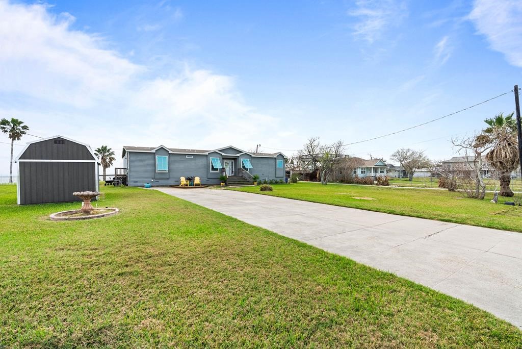 159 Copano Ridge Road Rockport, TX 78382 - Photo 7 of 31 a view of a house with a big yard and potted plants