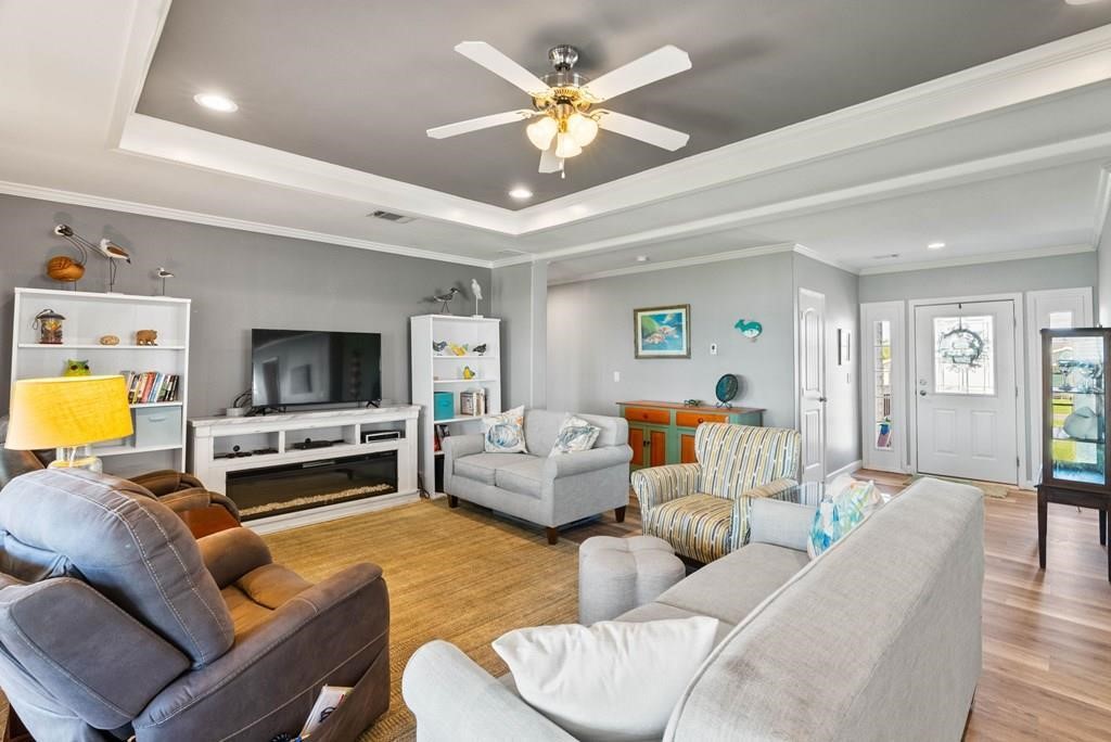 159 Copano Ridge Road Rockport, TX 78382 - Photo 10 of 31 a living room with furniture and a flat screen tv