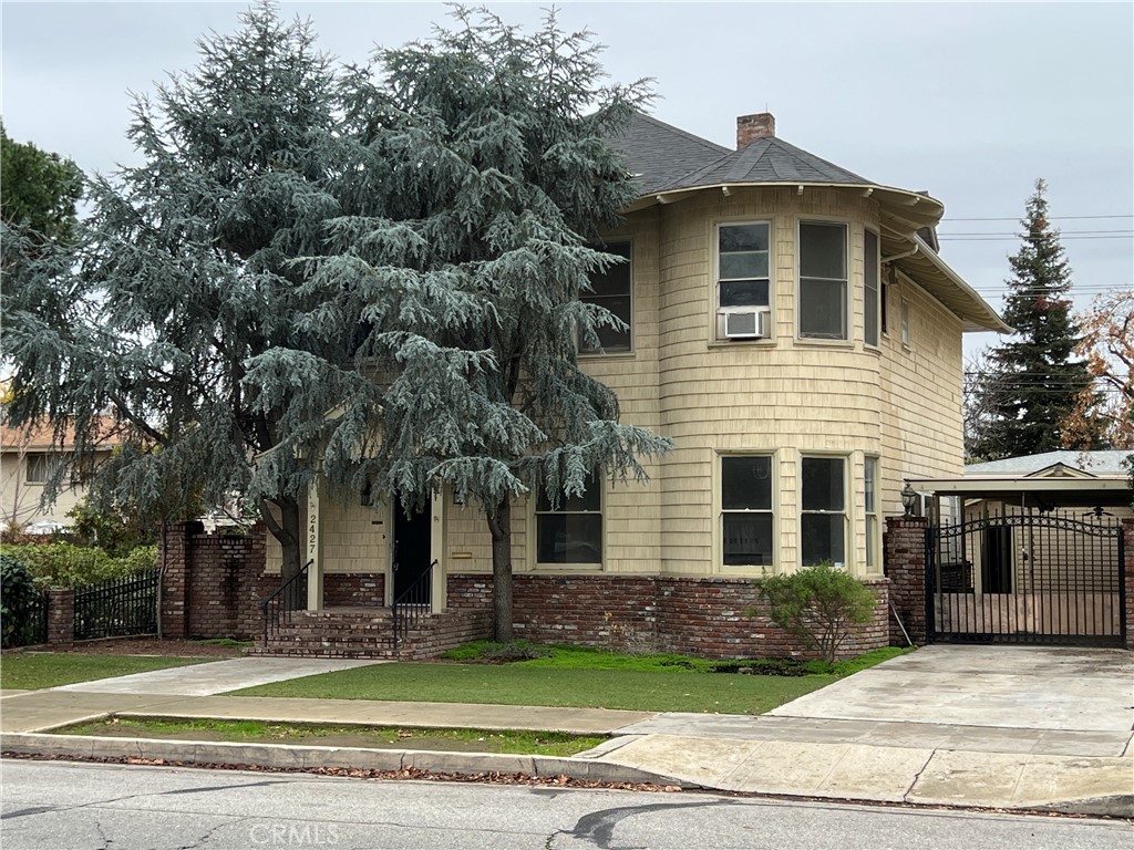 2427 19th Street Bakersfield, CA 93301 - Photo 1 of 1 a front view of a house with a yard