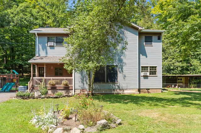 a front view of house with yard