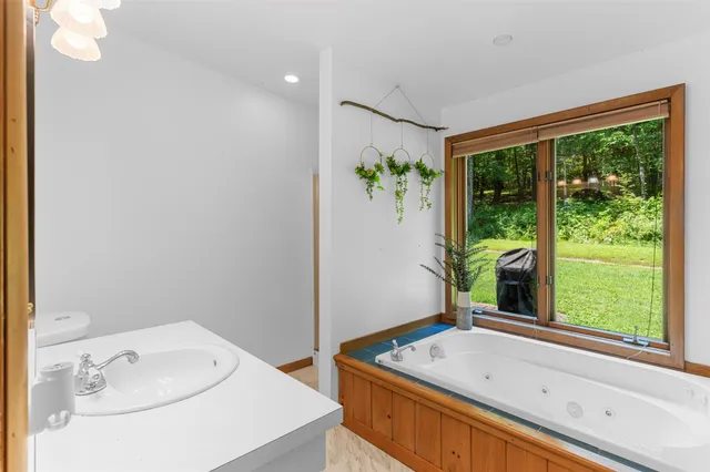a bathroom with a sink and a window