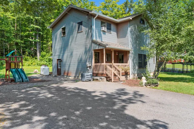 a view of a table and chairs under an umbrella