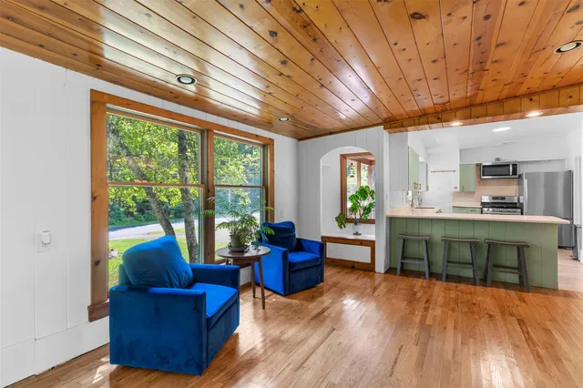 a large living room with furniture and a large window