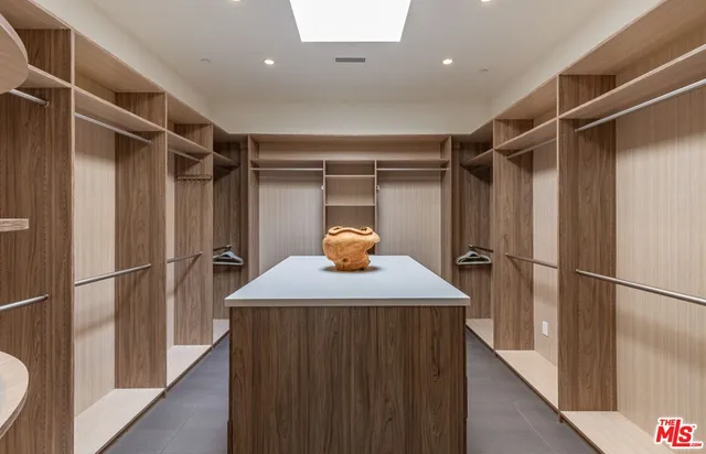 a hallway with a refrigerator in it