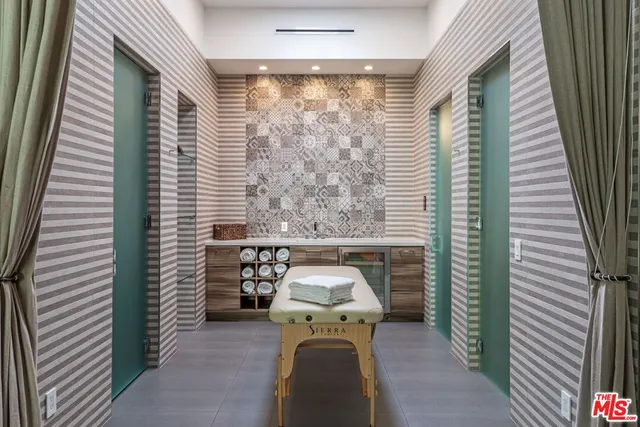 a view of a balcony with furniture and floor to ceiling window