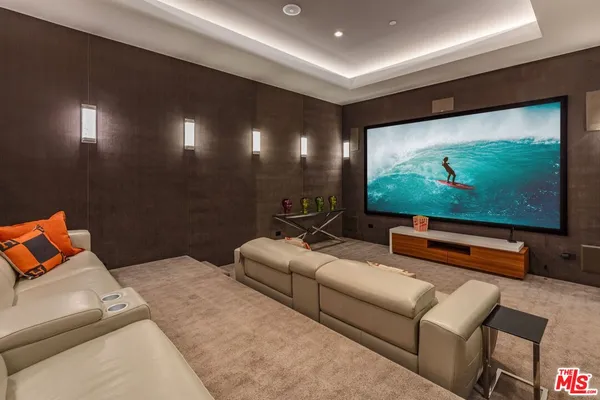 a projector room with projector and a couch