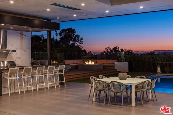 a dinning table and chairs in a patio