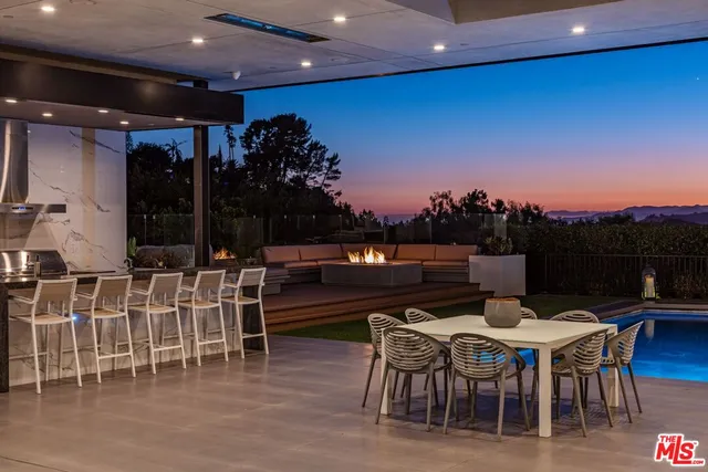 a dinning table and chairs in a patio