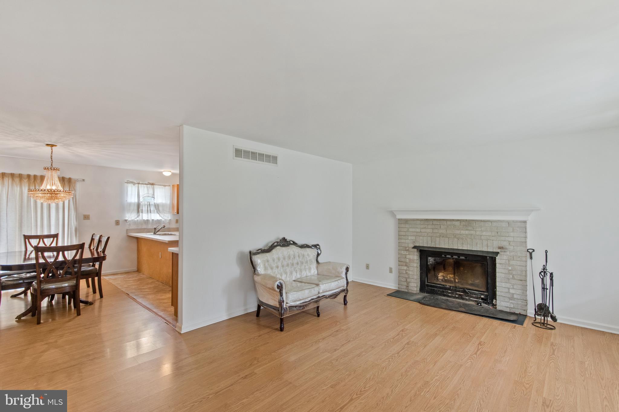 2412 Winslow Road Williamstown, NJ 08094 - Photo 3 of 23 Family room with WOOD flooring and FIREPLACE