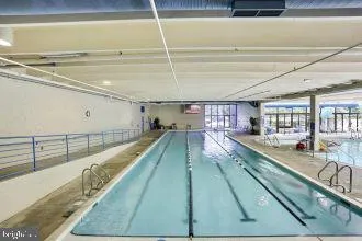 a view of swimming pool with outdoor seating