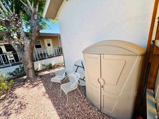 150 North 3050 East, Unit 4 St. George, UT 84790 - Photo 24 of 24 Exterior side yard featuring gravel landscaping and a mature tree