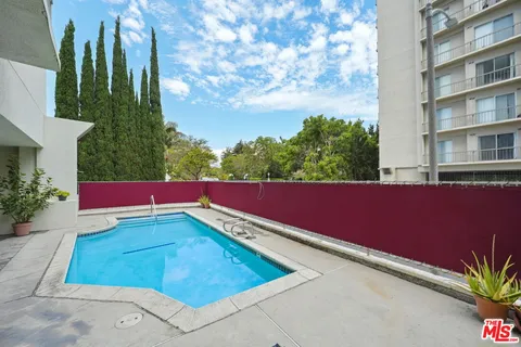 a view of an outdoor space with a swimming pool
