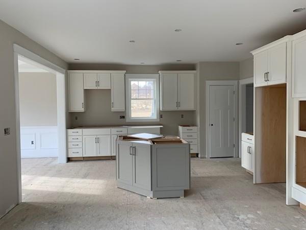120 Pulpit Road Bedford, NH 03110 - Photo 15 of 40 a kitchen with stainless steel appliances a refrigerator stove and sink