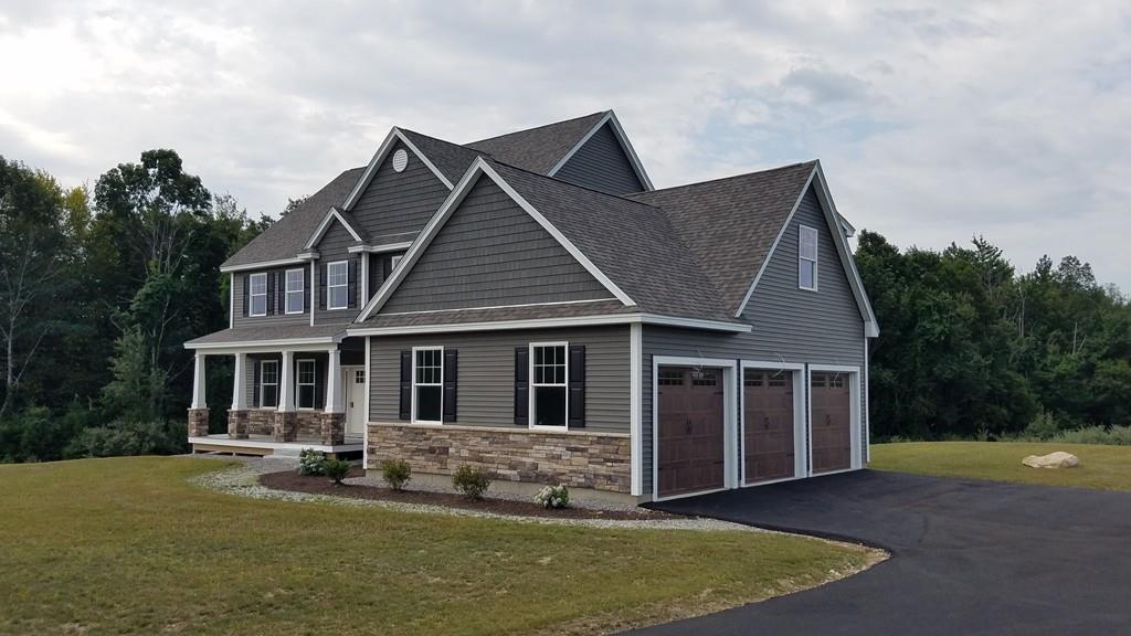 120 Pulpit Road Bedford, NH 03110 - Photo 2 of 40 a front view of a house with a yard