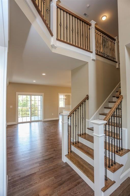 120 Pulpit Road Bedford, NH 03110 - Photo 24 of 40 a view of an entryway wooden floor and staircase