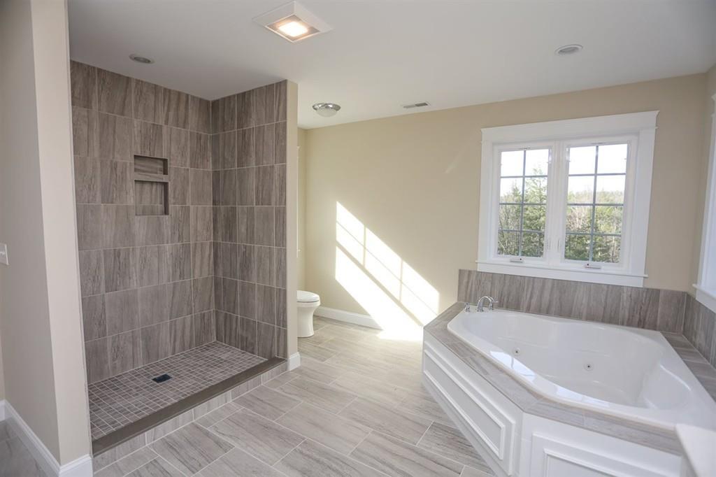 120 Pulpit Road Bedford, NH 03110 - Photo 36 of 40 a bathroom with a bathtub and a shower