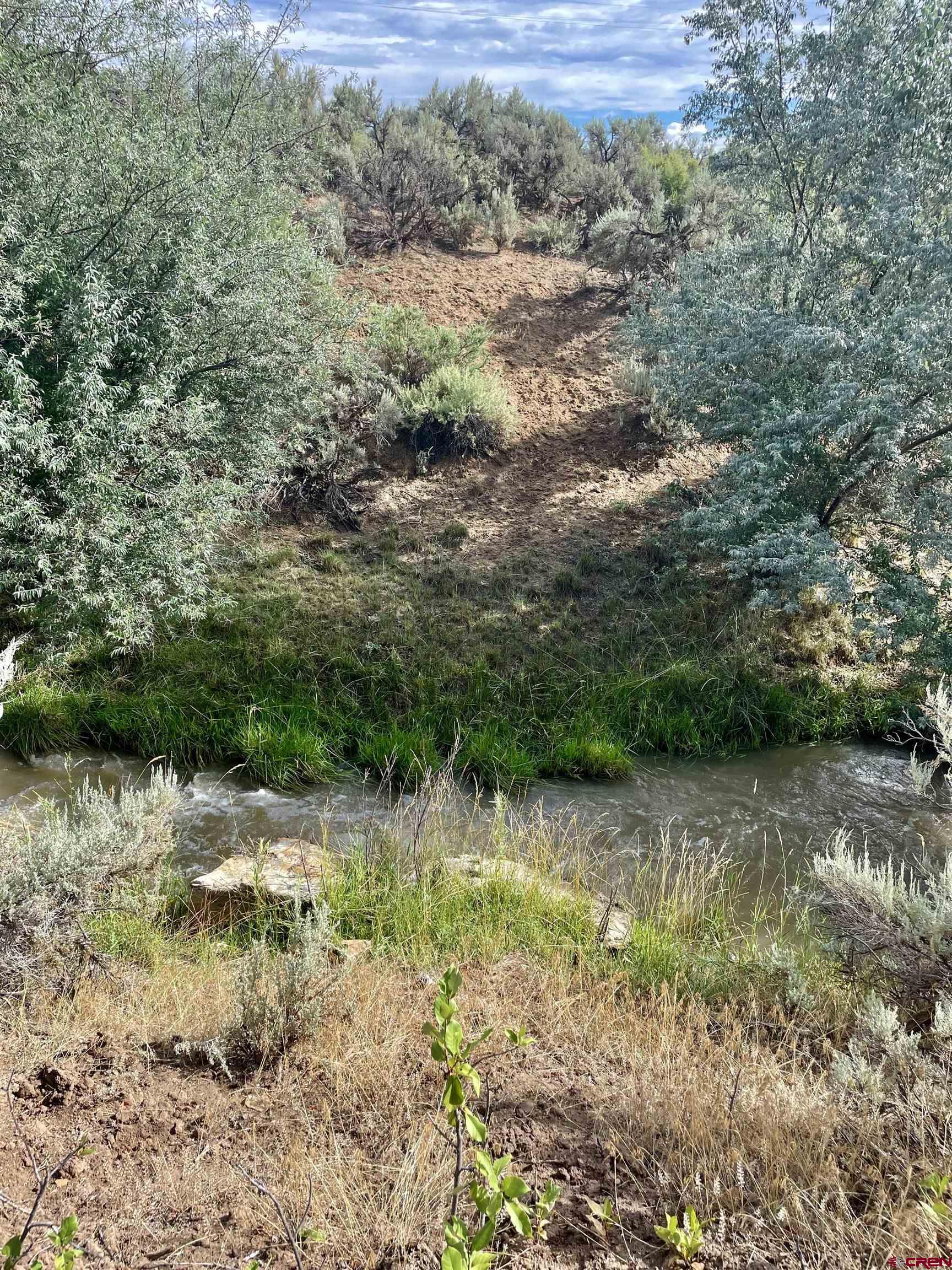 9 North Broadway Cortez, CO 81321 - Photo 5 of 21 a view of a lake with mountain view