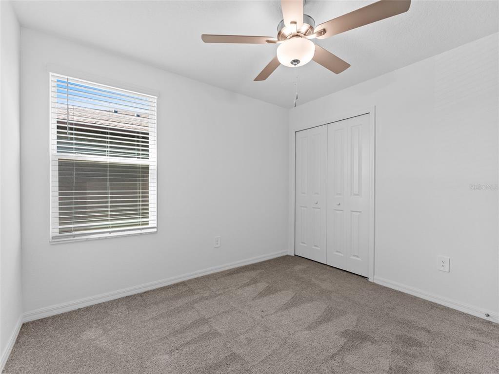 11628 Radiant Shr Loop San Antonio, FL 33576 - Photo 11 of 16 a view of an empty room with a window
