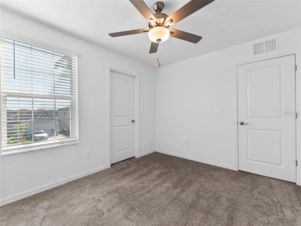 11628 Radiant Shr Loop San Antonio, FL 33576 - Photo 12 of 16 a view of an empty room with a window