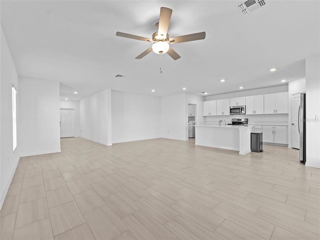 11628 Radiant Shr Loop San Antonio, FL 33576 - Photo 2 of 16 a view of an empty room with kitchen appliances