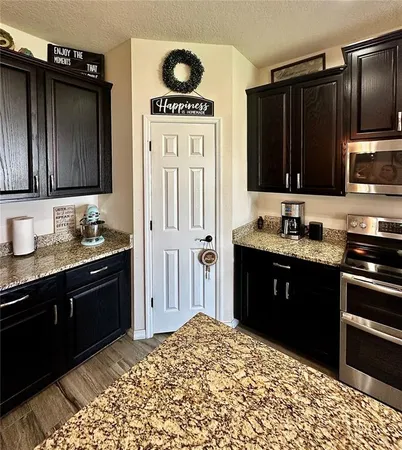 a view of a dining room with furniture wooden floor and a chandelier